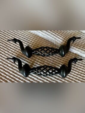 Pair (2) swirly antique look drawer pulls. Dark brown, some distressing.